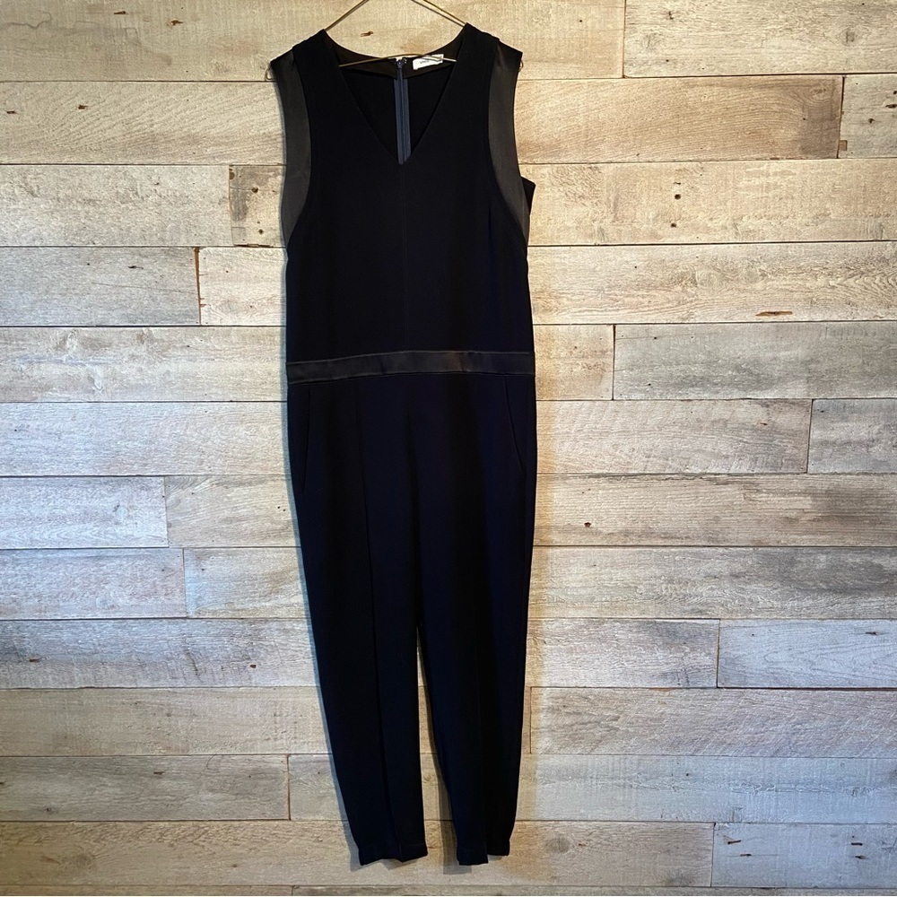 Vince. women's black sleeveless romper jumpsuit in size 4